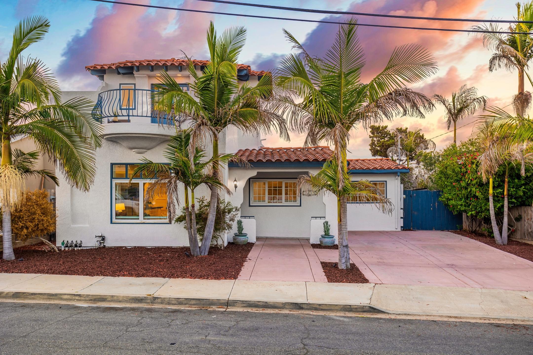 Stunning two-story retreat situated on a . 37 acre lot on a peaceful street in Point Loma. Enter the home to find an open floor plan with high ceilings and accent windows throughout! 